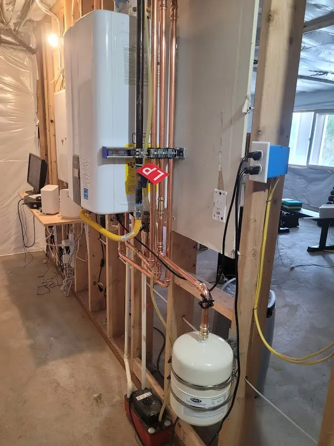 Licensed plumber repairing a kitchen sink in Stonecrest